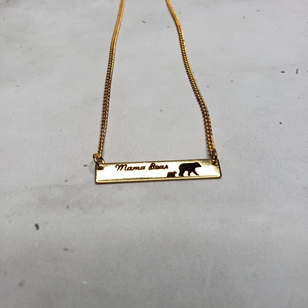 Mama bear yellow gold colored necklace